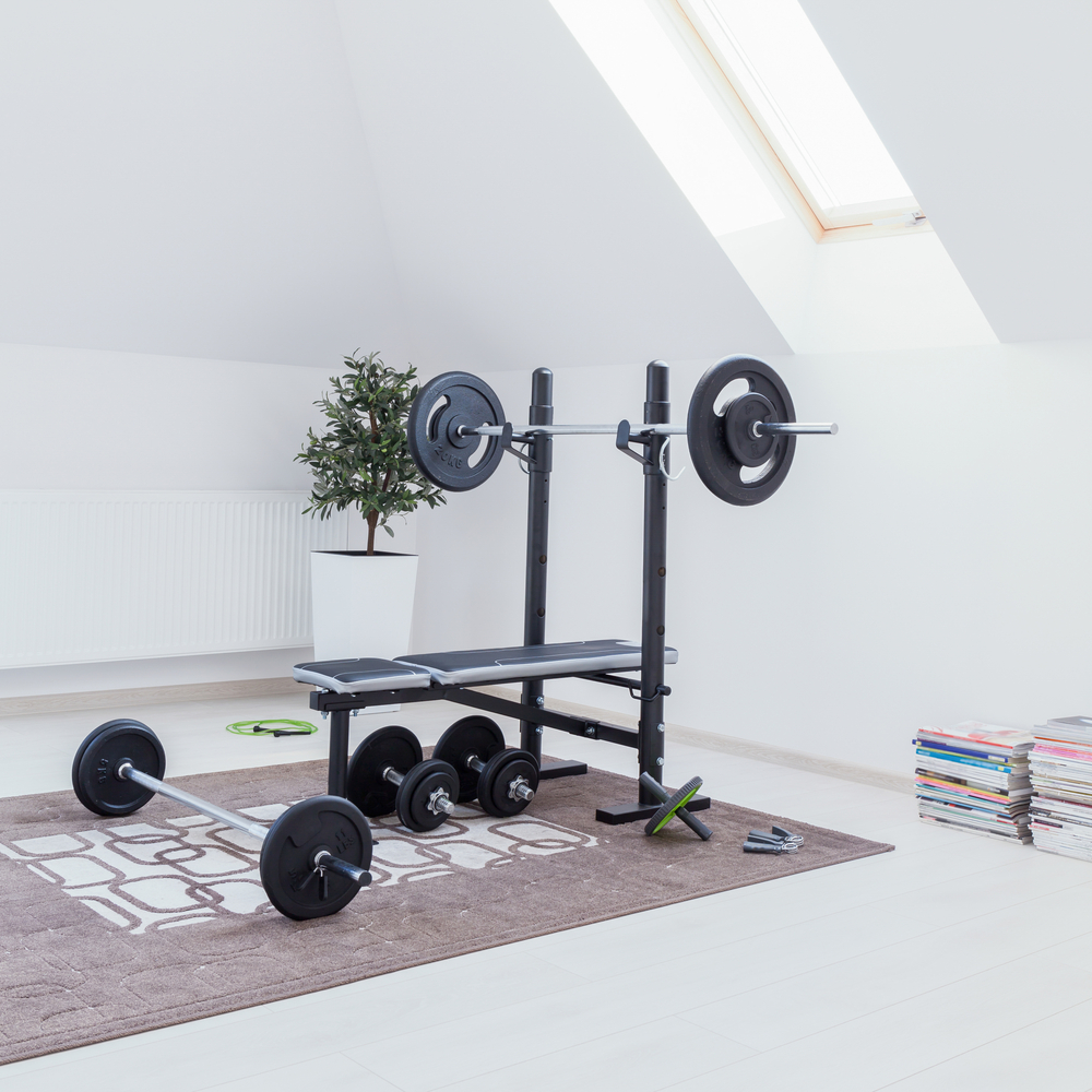 Home gym doesn't have to have that much equipment as normal gym. A full barbell, 100 kilograms of weight plates and stands for making squats should be sufficient for many of us!